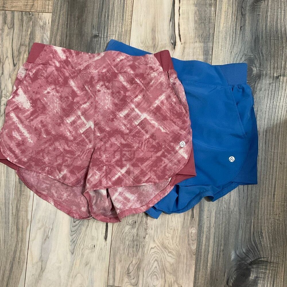 Two pairs of athletic running shorts, pink tye-dye and blue w/pockets size small